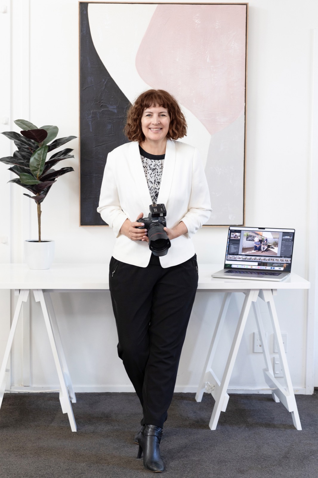 Belinda Bullock, photographer, with her camera and laptop